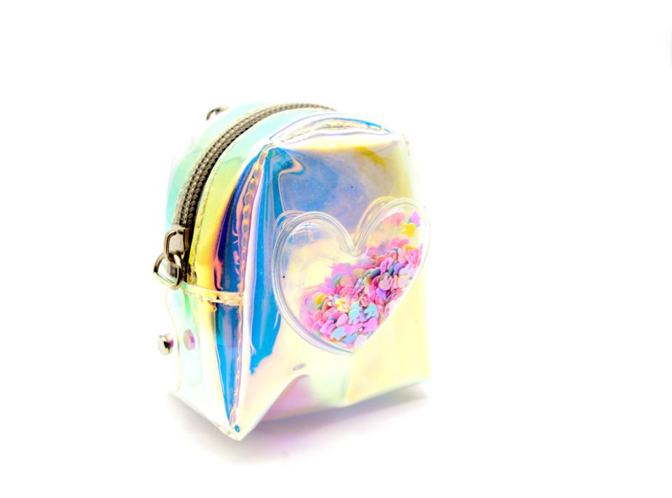 Handmade purse-keychain, made of translucent iridescent plastic, decorated with a transparent heart with colored beads