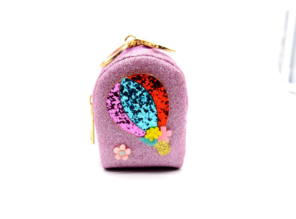 Handmade purse-keychain, made of leather with glitter in lilac color, decorated with a balloon, made of different colors of glitter