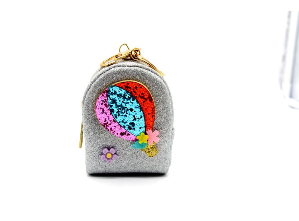 Handmade purse-keychain, made of leather with glitter in silver color, decorated with a balloon, made of different colors of glitter