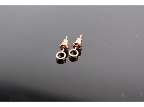 Stud earrings 925, in the shape of a mini ring, in rose gold color.