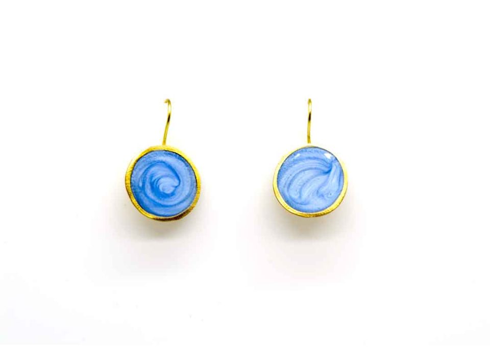 Handmade forged round earring in light blue color.