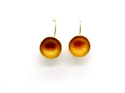 Handmade forged hollow round earring in mustard color.