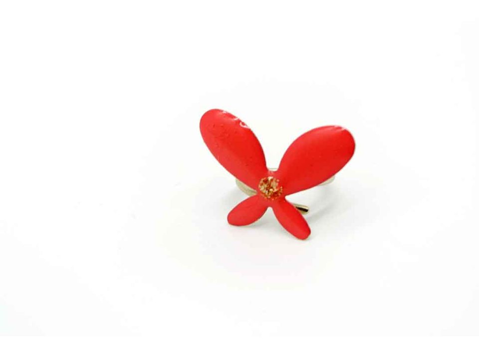 Handmade ring on a silver base in the shape of a butterfly and coral color.