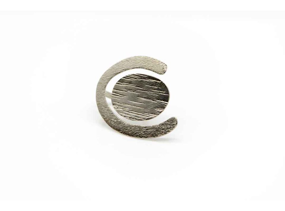 Handmade forged ring in oval shape silver color.