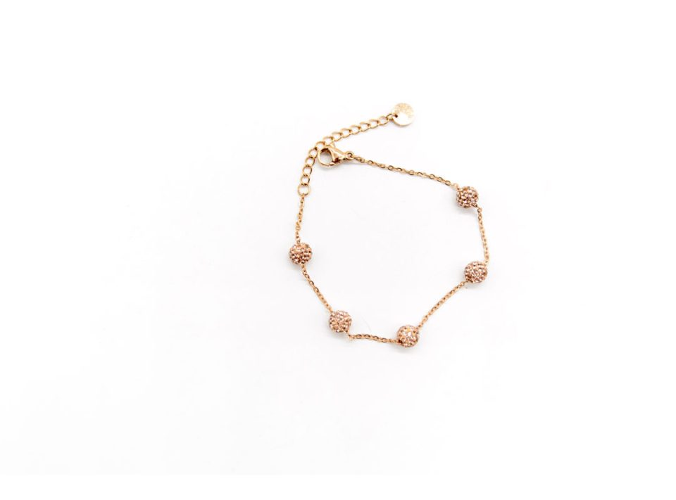 Steel bracelet in rose gold color, with rhinestone balls