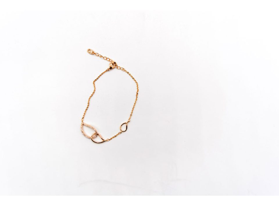 Steel bracelet in rose gold color, with rhinestone leaf shapes