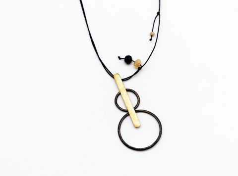 Handmade necklace forged element two rings black on gold bar