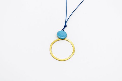 necklace forged gold element ring hung from round with light blue