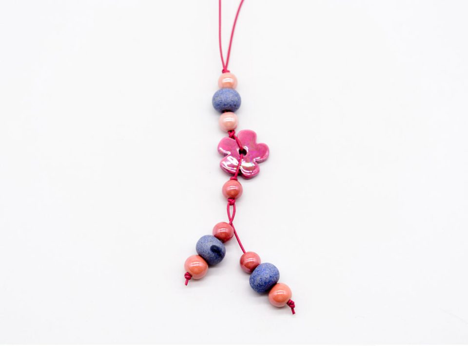 Handmade long necklace with ceramic elements in pink light blue shades