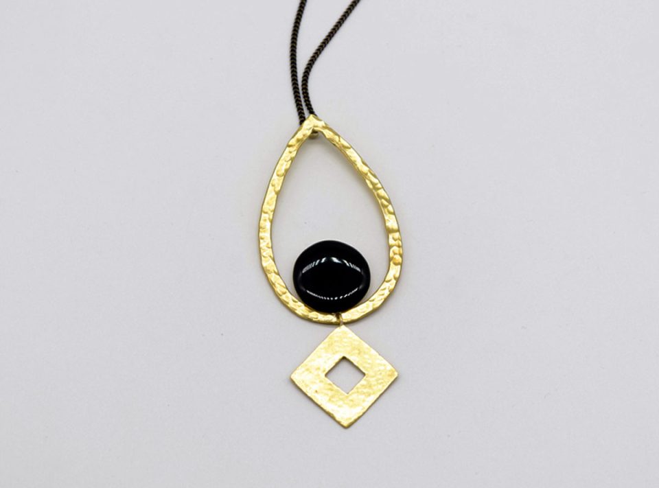 teardrop forged element necklace with black enamel and a gold rhombus