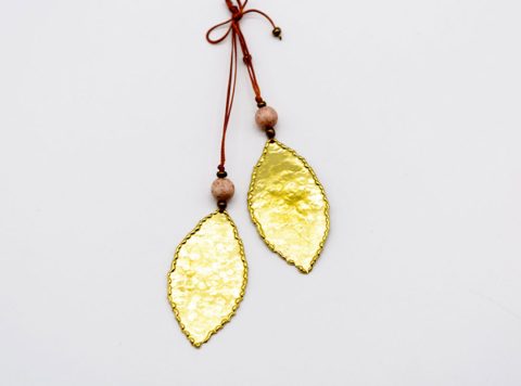 Handmade long necklace with two forged leaves in gold color