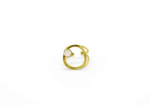 Handmade forged ring on gold base round on white.