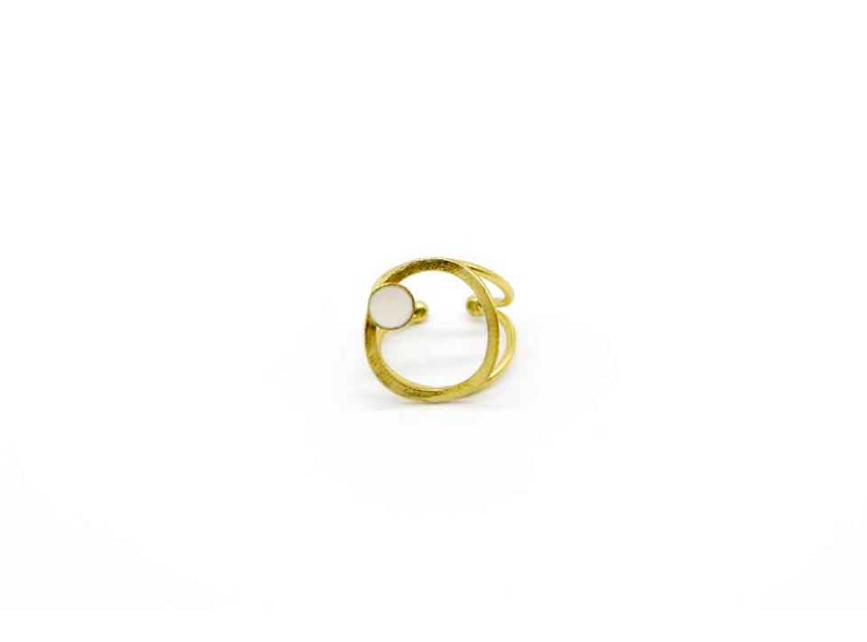 Handmade forged ring on gold base round on white.