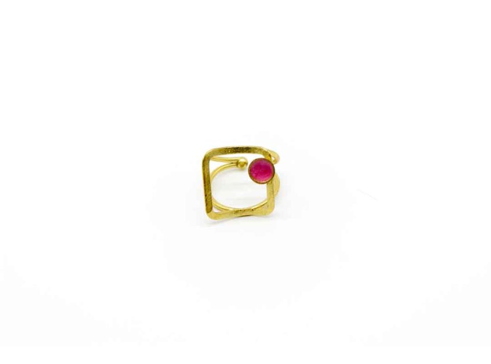 Handmade forged ring on gold base with square design.