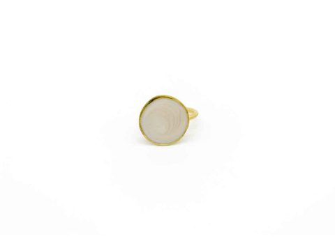 Handmade ring forged round design on white pearl.