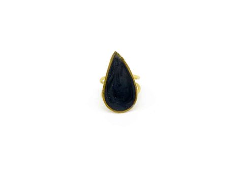 Handmade forged ring on gold base with gray teardrop design.