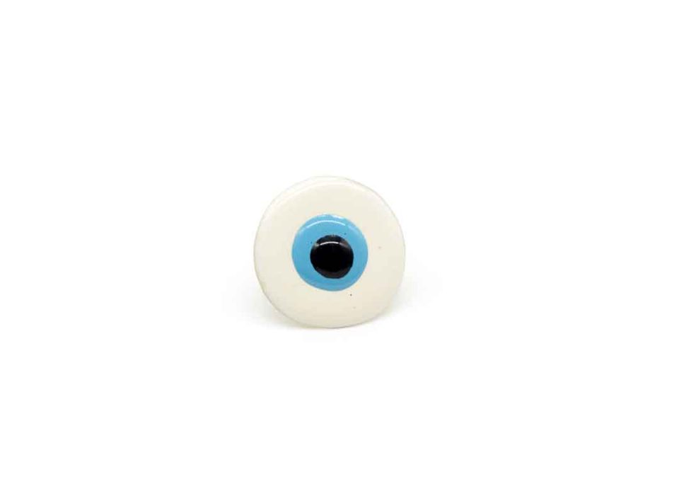 Handmade forged ring with round white enamel eye.