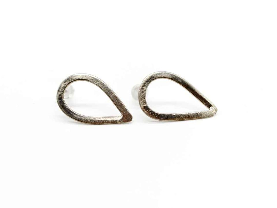 Handmade forged earring glued tear perforated silver.