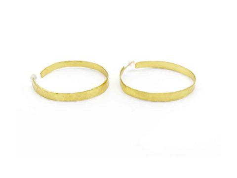 Handmade forged hoop earring in gold color