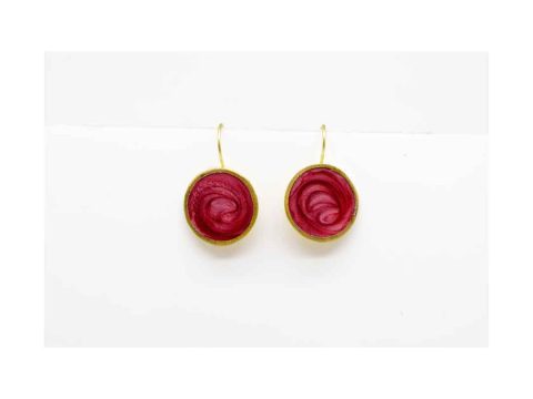 Handmade forged round earring in the color of rotten apple