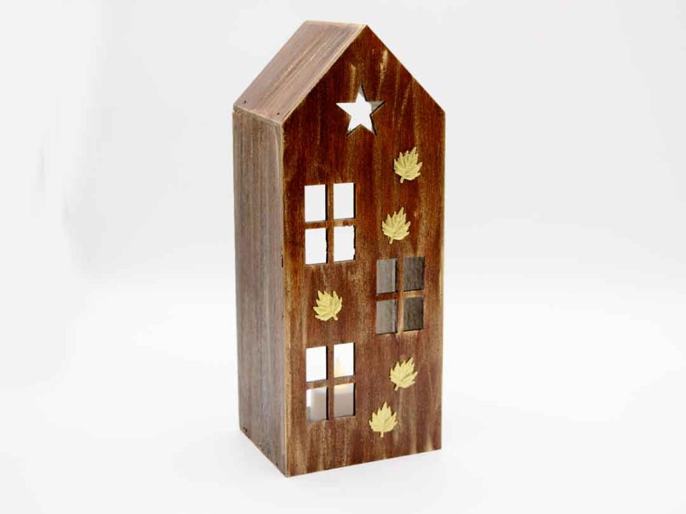 small wooden house for tealight in cafe with mini bronze maple leaves