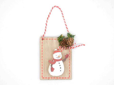 Handmade wooden ornament with snowman peg.