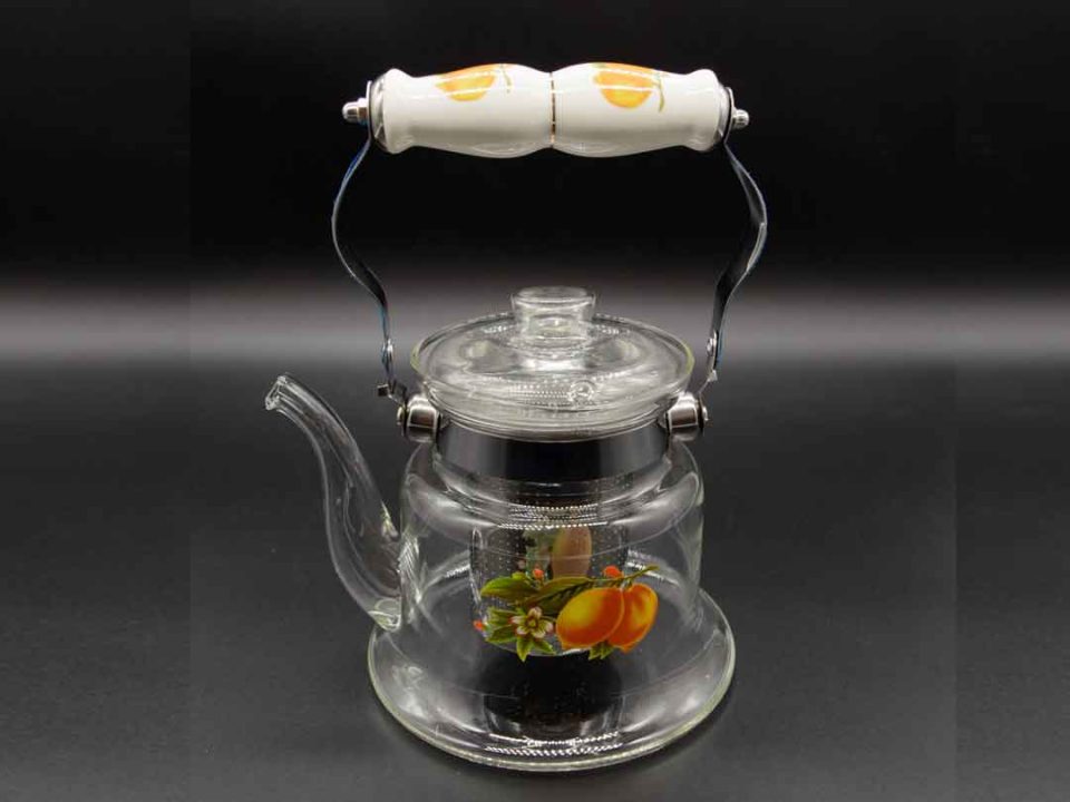 Transparent fireproof teapot with lemons