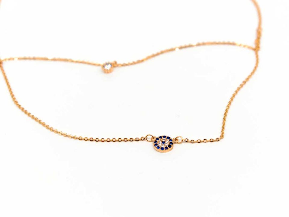 Necklace short steel, double, in rose gold, round eye rhinestones and a rhinestone.