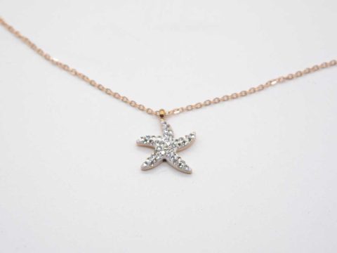 Short steel necklace in rose gold color with a starfish with rhinestones