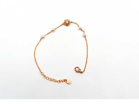 Steel bracelet in rose gold color, with rhinestone flower and pearls