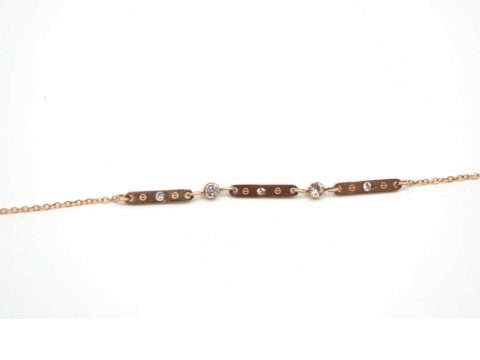 Steel bracelet in rose gold with metal rods joined with rhinestones.