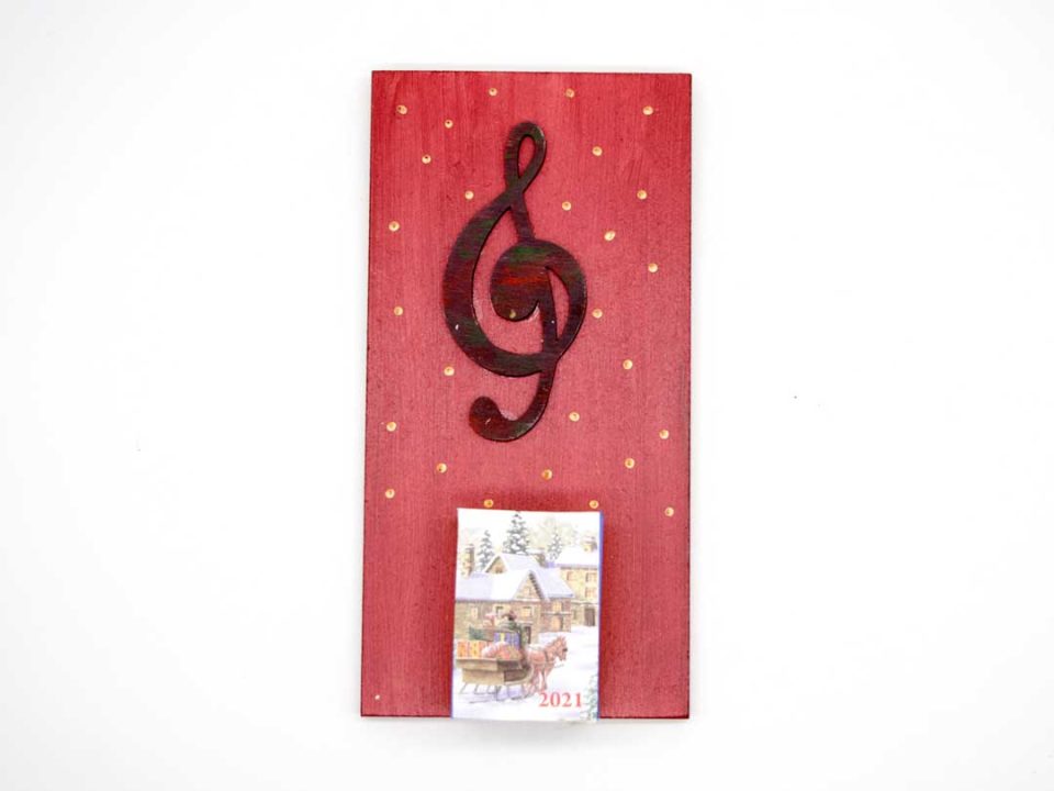 Handmade wooden diary with the key of the treble clef.