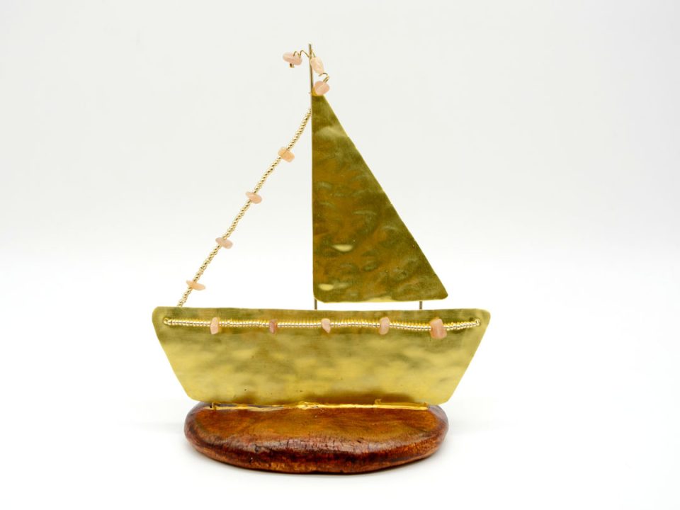 Handmade bronze boat with a sail in gold on a base