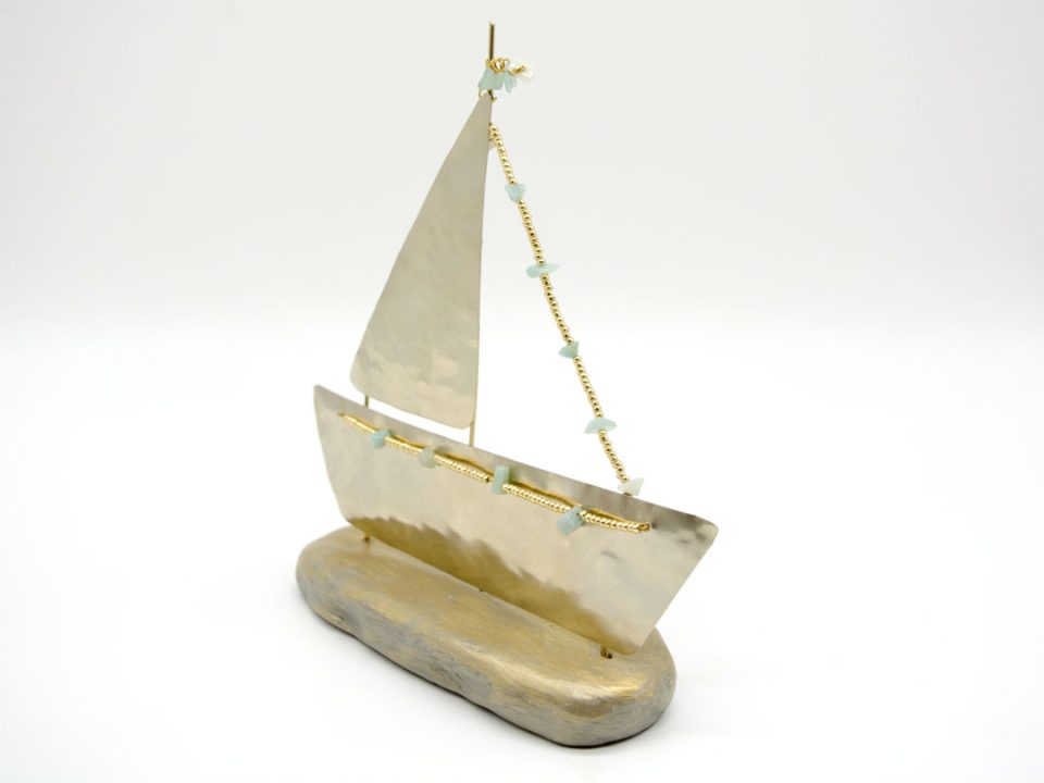 Handmade forged alpaca boat in silver color with a sail