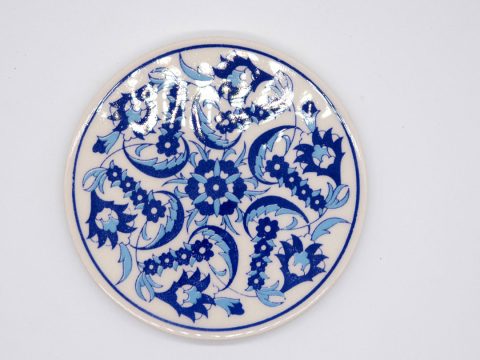 Round ceramic coaster with blue flowers