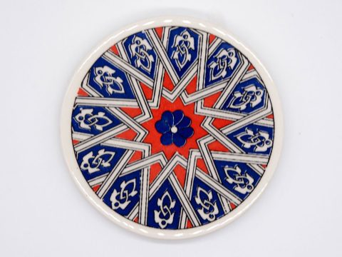 Round ceramic coaster with red star