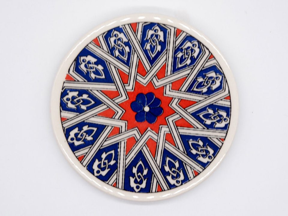 Round ceramic coaster with red star