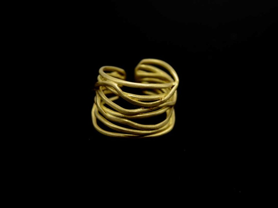 Handmade forged ring, in gold color, many tangled rods.