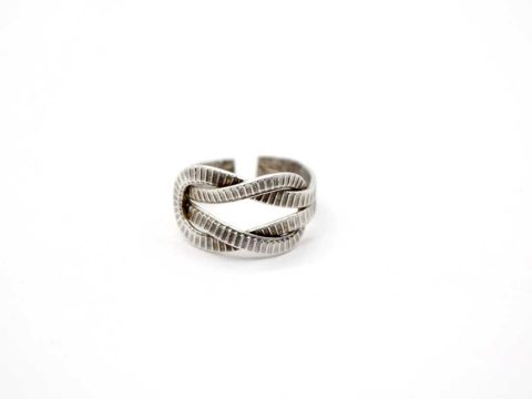 Handmade forged ring, in silver color, tied like a knot.