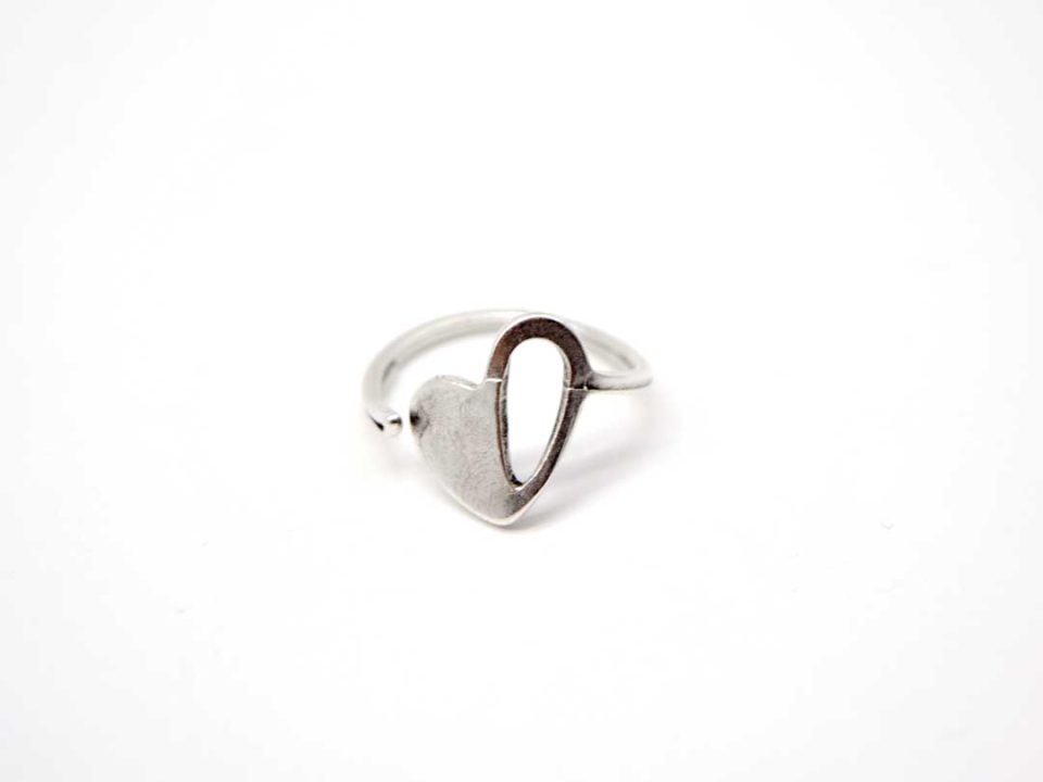 Handmade hammered ring small silver color with perforated heart.