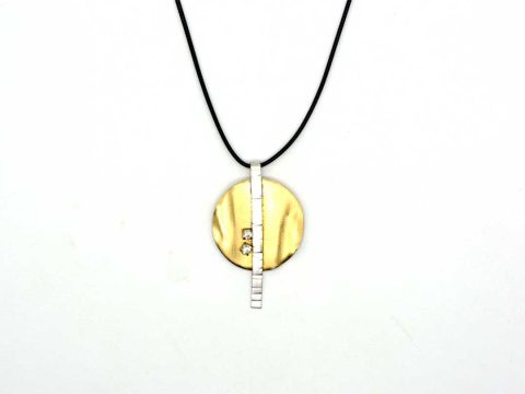 necklace a special forged round gold color with silver bar.