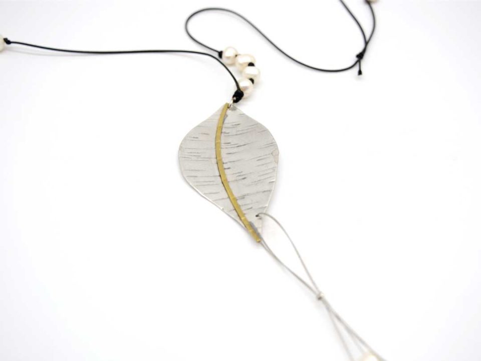 Handmade long necklace with forged silver leaf with gold and pearls.