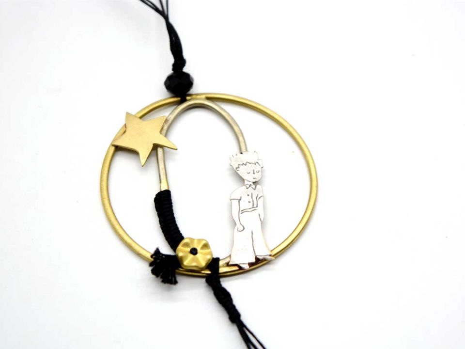 necklace with forged round element with the little prince and a star