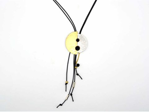 necklace forged round silver element with gold and black gems