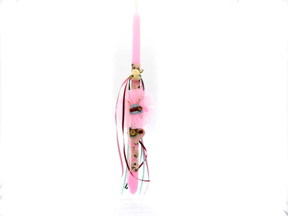 Classic shape candle in pink color, decorated with two beautiful, handmade bones