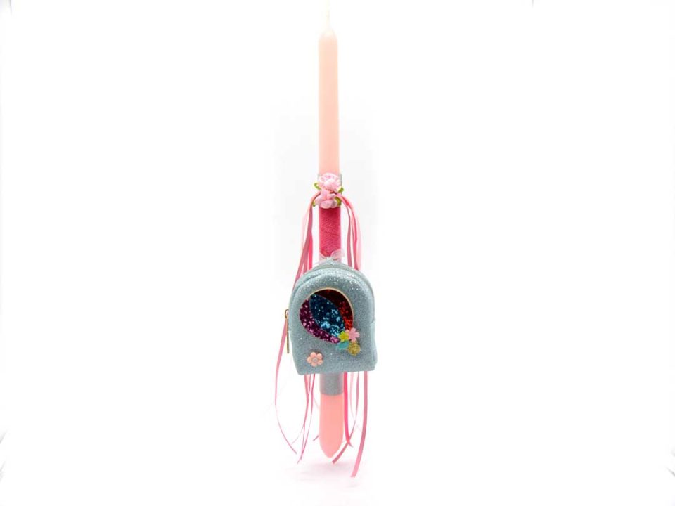 Handmade Easter candle classic shape in pink color, decorated with a beautiful, handmade keychain purse in light blue glitter color.