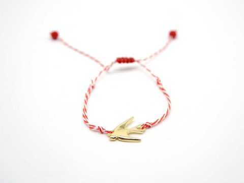 Handmade March bracelet, with metallic swallow in gold