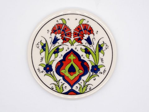 Round ceramic coaster with red and blue flowers