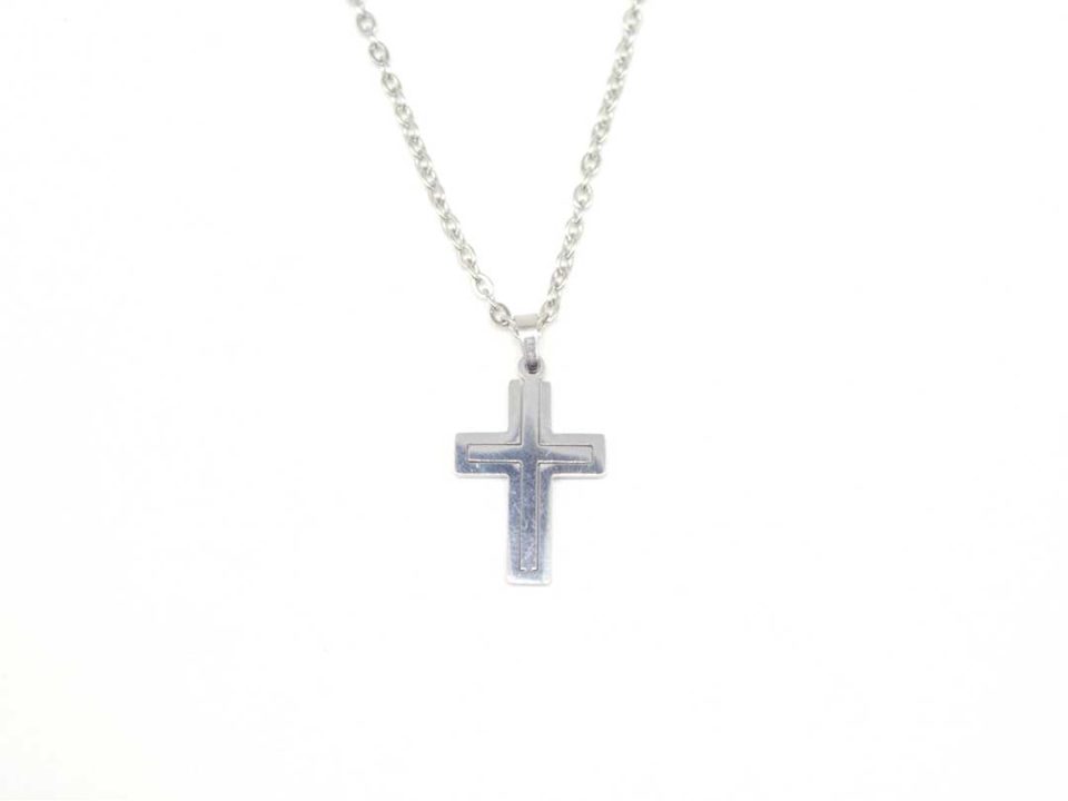 Steel cross in silver color with engraving and chain.