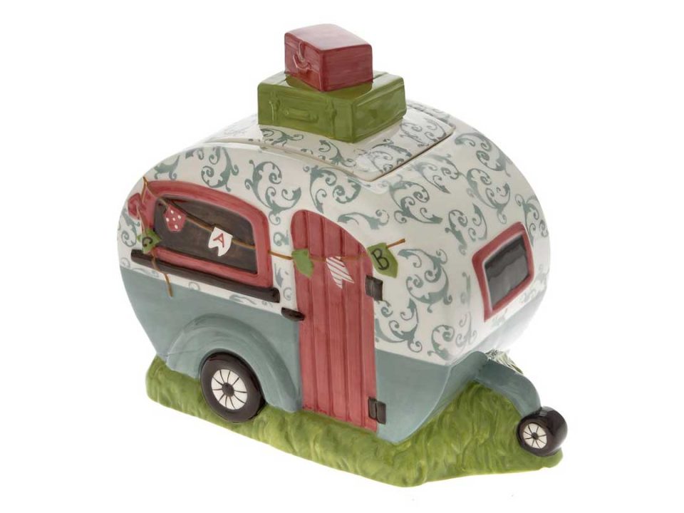 Ceramic cookie box in the shape of a bright green-pink antique caravan